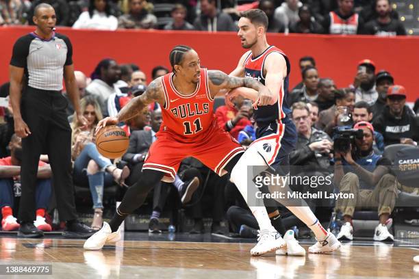 DeMar DeRozan of the Chicago Bulls tries to get by Tomas Satoransky of the Washington Wizards in the first quarter during a NBA basketball game at...