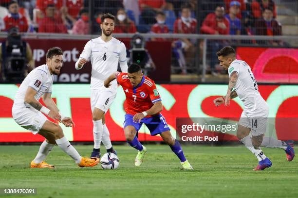 Alexis Sanchez of Chile drives the ball during the FIFA World Cup Qatar 2022 qualification match between Chile and Uruguay ay Estadio San Carlos de...