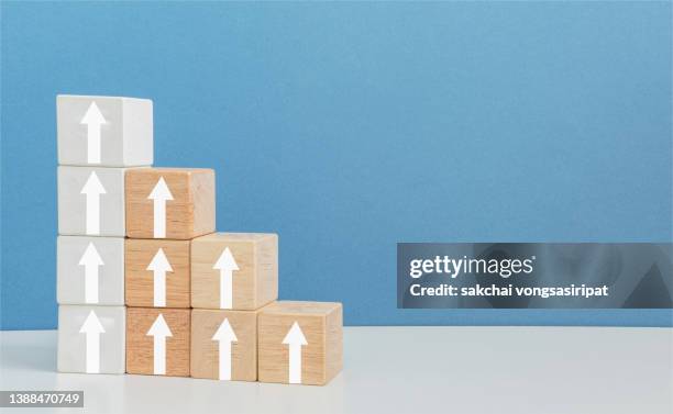 wood block with arrow business concept still life, white arrow moving up on wooden blocks, achievement,  concept, rating, satisfaction concepts - performance rating stock pictures, royalty-free photos & images