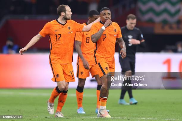 Steven Bergwijn of Netherlands celebrates their team's first goal with teammate Daley Blind during the international friendly match between...