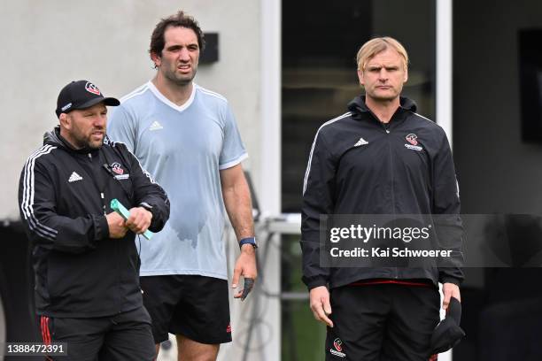 Assistant Coach Jason Ryan, Samuel Whitelock and Head Coach Scott Robertson look on during a Crusaders Super Rugby training session at Rugby Park on...