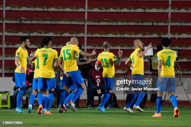 Richarlison of Brazil celebrates with teammates after scoring the second goal of his team during a match between Bolivia and Brazil as part of FIFA...