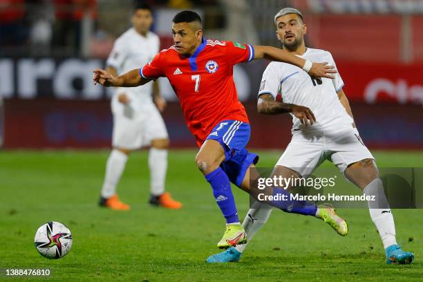 Alexis Sanchez of Chile drives the ball with during the FIFA World Cup Qatar 2022 qualification match between Chile and Uruguay at Estadio San Carlos...