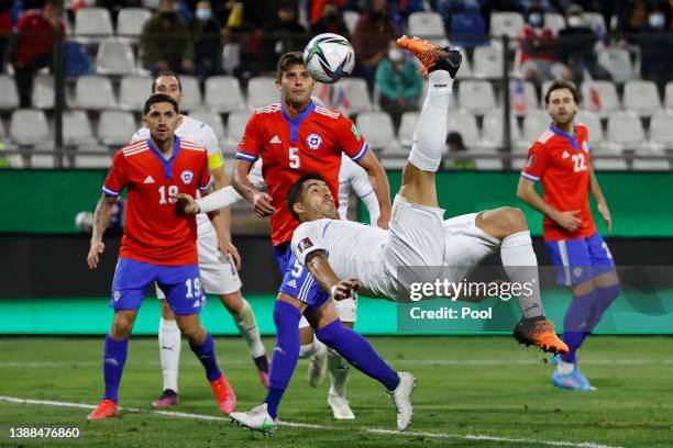 Luis Suarez of Uruguay kicks the ball to score the first goal of his team during the FIFA World Cup Qatar 2022 qualification match between Chile and...