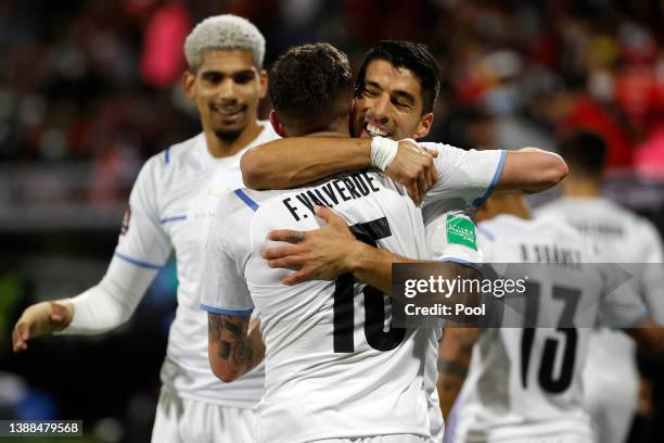 Federico Valverde of Uruguay celebrates with teammate Luis Suarez after scoring the second goal of his team during the FIFA World Cup Qatar 2022...