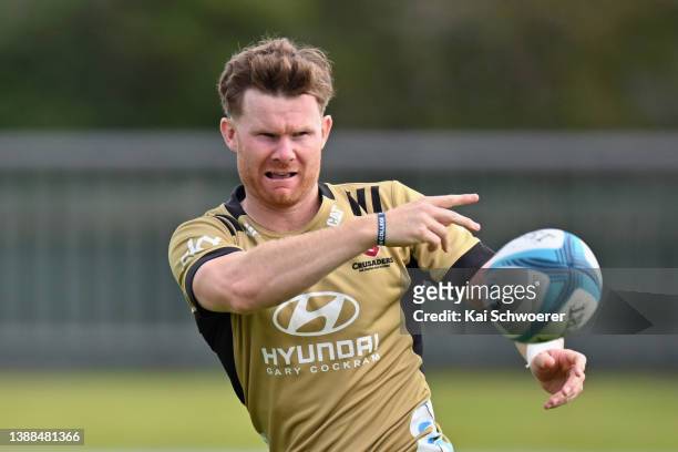 Mitchell Drummond passes the ball during a Crusaders Super Rugby training session at Rugby Park on March 30, 2022 in Christchurch, New Zealand.