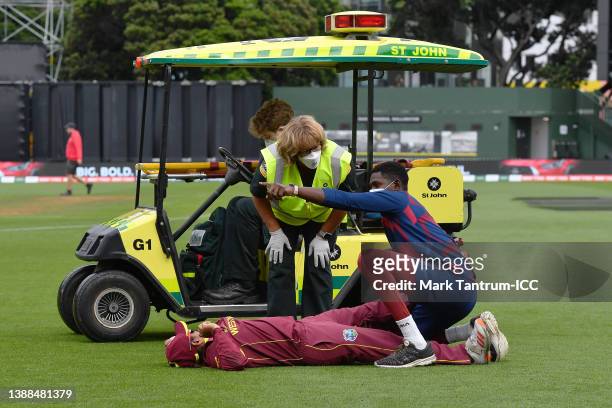 Anisa Mohammed of the West Indies is seen getting medical treatment during the 2022 ICC Women's Cricket World Cup match between Australia and the...