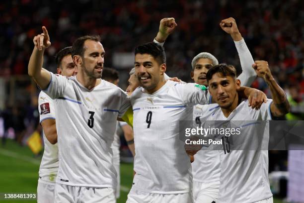 Luis Suarez of Uruguay celebrates with teammates after scoring the first goal of his team during the FIFA World Cup Qatar 2022 qualification match...