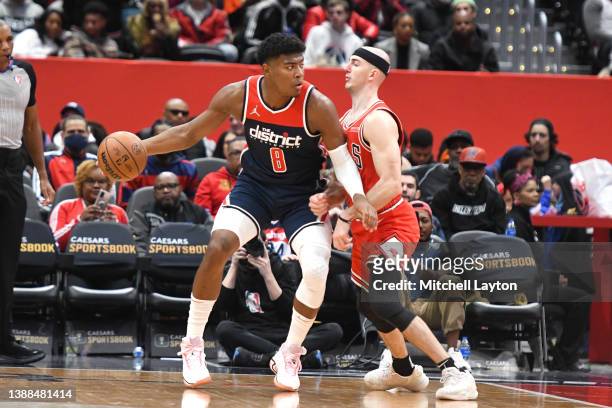 Rui Hachimura of the Washington Wizards tries to get by Alex Caruso of the Chicago Bulls in the third quarter during a NBA basketball game at Capital...