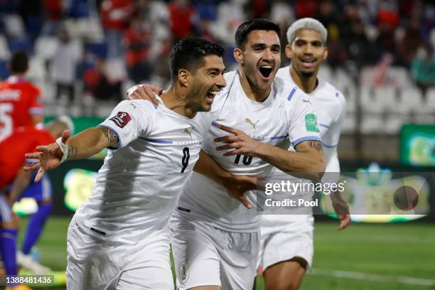 Luis Suarez of Uruguay celebrates with teammatesafter scoring the first goal of his team during the FIFA World Cup Qatar 2022 qualification match...