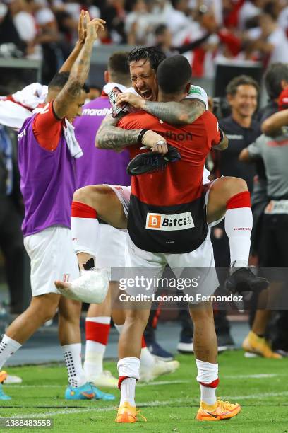 Gianluca Lapadula of Peru celebrates with teammate after winning the FIFA World Cup Qatar 2022 qualification match between Peru and Paraguay at...