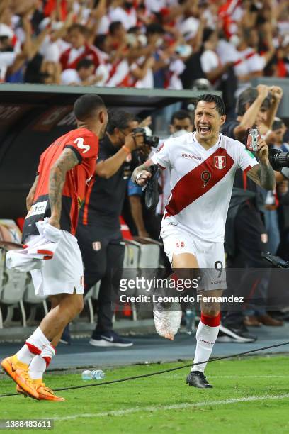 Gianluca Lapadula of Peru celebrates with teammate after winning the FIFA World Cup Qatar 2022 qualification match between Peru and Paraguay at...
