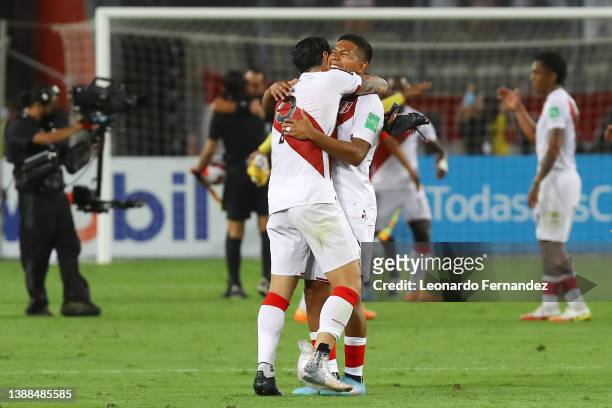 Gianluca Lapadula of Peru celebrates with teammate Edison Flores after winning the FIFA World Cup Qatar 2022 qualification match between Peru and...