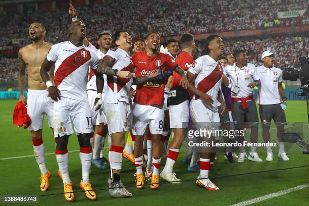 Luis Advíncula and Gianluca Lapadula of Peru celebrate with teammates after winning the FIFA World Cup Qatar 2022 qualification match between Peru...