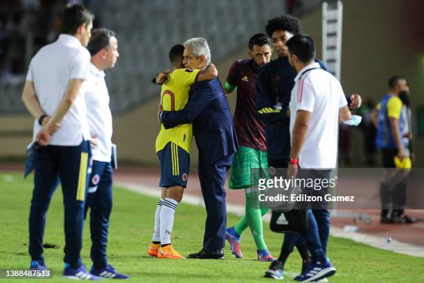 Head coach of Colombia Reinaldo Rueda comforts his players after being disqualified during the FIFA World Cup Qatar 2022 qualification match between...