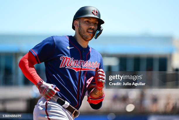 Carlos Correa of the Minnesota Twins runs the bases after hitting a home run in the fourth inning against the Tampa Bay Rays during a Grapefruit...