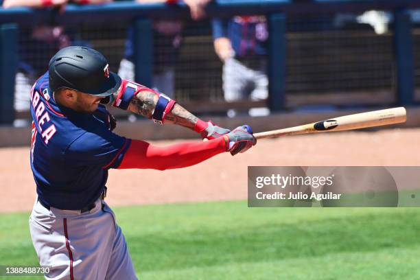 Carlos Correa of the Minnesota Twins hits a foul in the fifth inning against the Tampa Bay Rays during a Grapefruit League spring training game at...