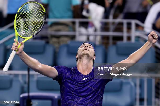 Miomir Kecmanovic of Serbia celebrates after defeating Taylor Fritz of the United States during the Men's Singles match on Day 9 of the 2022 Miami...