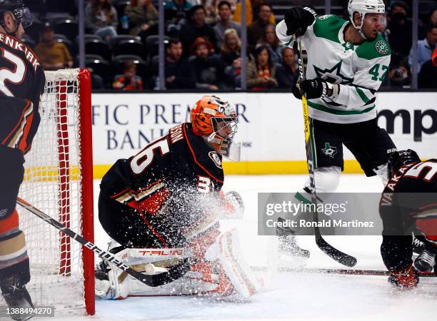 John Gibson of the Anaheim Ducks makes a save against the Dallas Stars in the second period at Honda Center on March 29, 2022 in Anaheim, California.