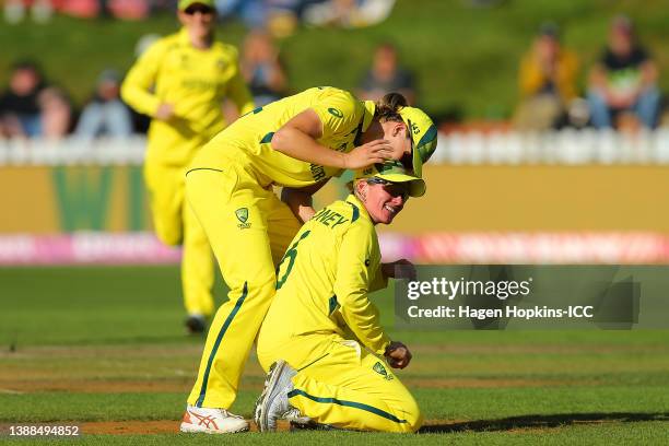 Beth Mooney of Australia is congratulated by team mates after catching out Rashada Williams of West Indies during the 2022 ICC Women's Cricket World...
