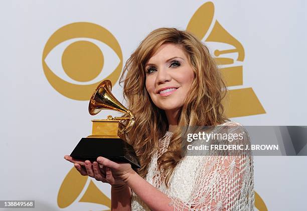 Alison Krauss poses with the trophy for the Best Bluegrass album for "Paper Airplane" at the 54th Grammy Awards in Los Angeles, California, February...