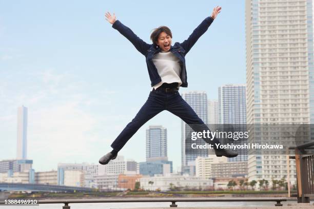 men jumping up high - hovering stock pictures, royalty-free photos & images