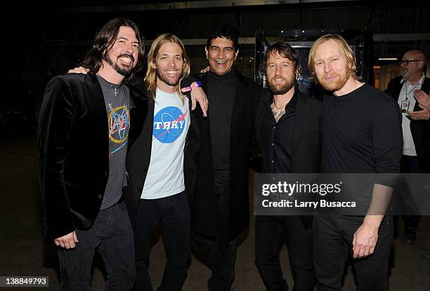 Dave Grohl, Taylor Hawkins, Pat Smear, Chris Shiflett and Nate Mendel of The Foo Fighters backstage at the 54th Annual GRAMMY Awards held at Staples...