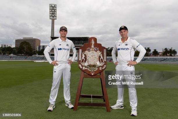 Victorian captain Peter Handscomb and West Australian captain Shaun Marsh pose with the Sheffield Shield during a Sheffield Shield Final media...
