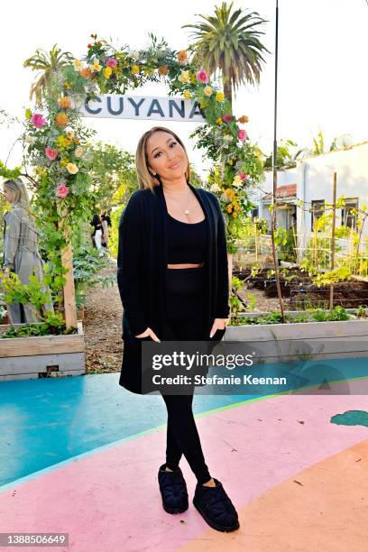 Adrienne Bailon attends a celebration of Cuyana's new Stretch Collection at Little City Farm on March 29, 2022 in Los Angeles, California.