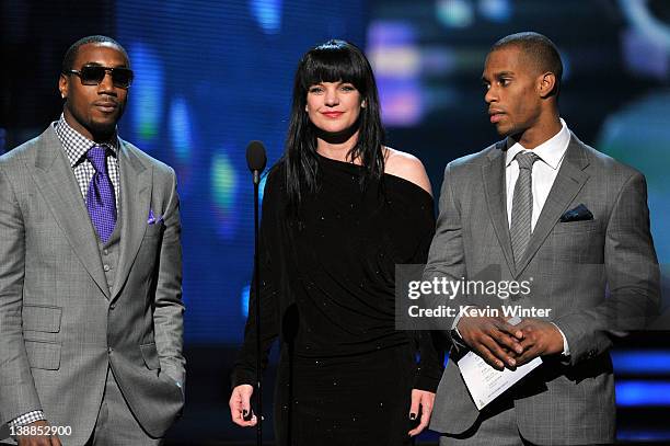 Actress Pauley Perrette with NFL players Mario Manningham and Victor Cruz of the New York Giants speak onstage at the 54th Annual GRAMMY Awards held...