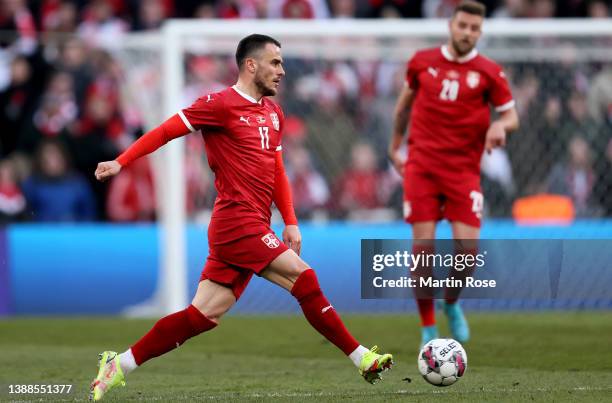 Filip Kostić of Serbia controls the ball during the international friendly match between Denmark and Serbia at Parken Stadium on March 29, 2022 in...