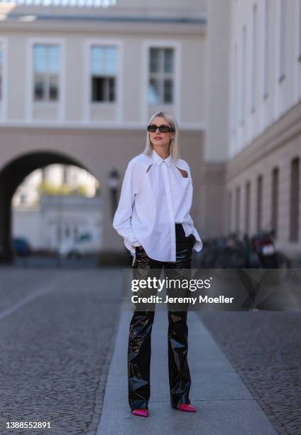 Lena Gercke seen wearing a black sunglasses from Prada, a white shirt blouse from LeGer, a black latex vinyl MSGM pants, a white leather vinyl...