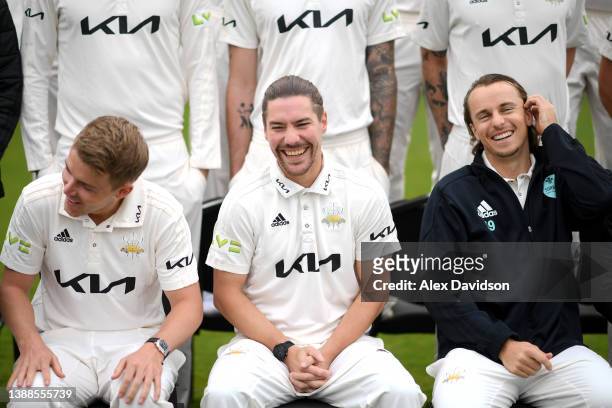 Sam Curran, Rory Burns and Tom Curran react during the Surrey CCC Photocall at The Kia Oval on March 30, 2022 in London, England.