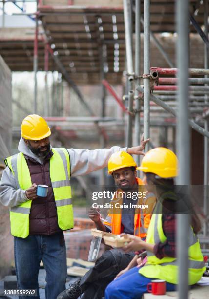Construction Workers Eat Lunch Together Photos and Premium High Res