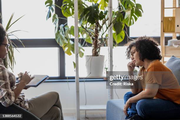 encouraging therapist talking with a patient - mental health awareness month stock pictures, royalty-free photos & images