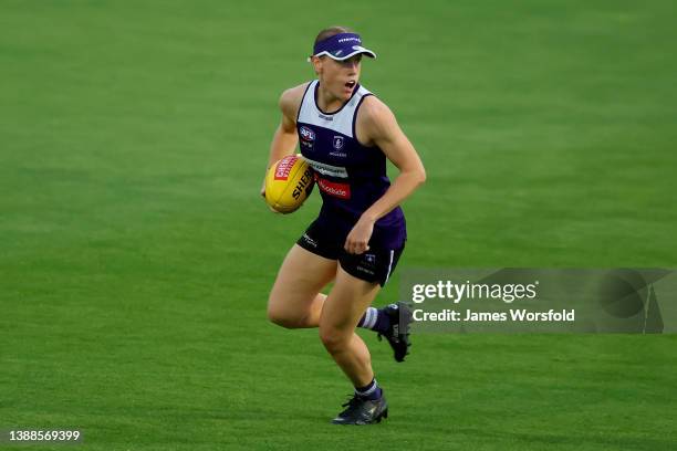 Ebony Antonio of the Dockers looks to move on with the ball during a Fremantle Dockers AFLW training session at Victor George Kailis Oval on March...