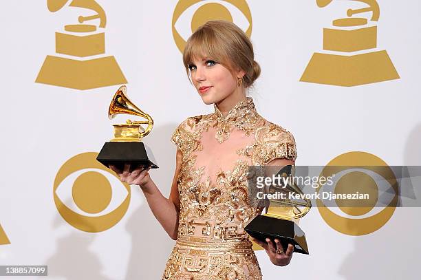 Singer/songwriter Taylor Swift, winner of the GRAMMYs for Best Country Song with "Mean" and Best Country Solo Performance for "Mean", poses in the...