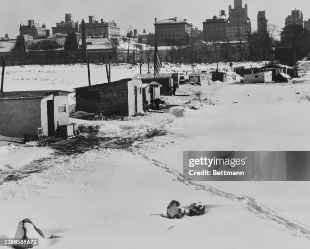 Footprints in the snow leading from makeshift dwellings, constructed by the destitute, in Central Park, New York City, New York, circa January 1933.