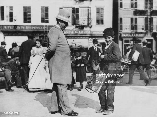 Young shoeshine boy with a policeman on Mulberry Street in Lower Manhattan, New York City, New York, 1897. Often referred to as known as the 'Italian...