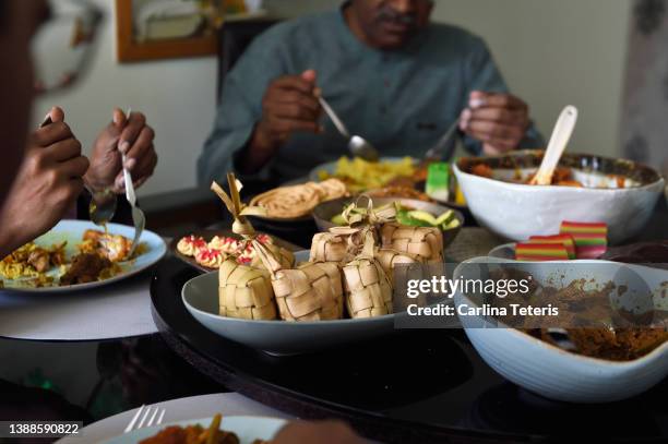 table covered with food for eid - ketupat stock pictures, royalty-free photos & images