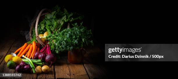 still life close-up of vegetables assorted on wooden table and basket with copy space - rote beete bildbanksfoton och bilder