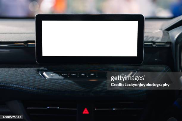 a digital display screen on the dashboard of a modern car - auto display stock-fotos und bilder
