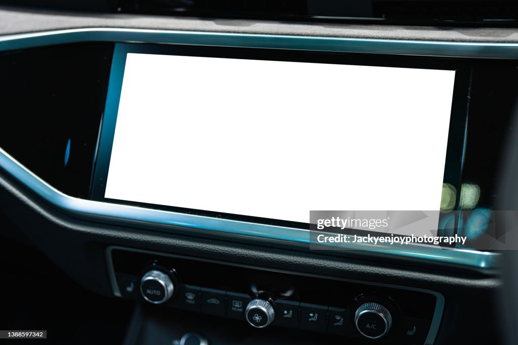A digital display screen on the dashboard of a modern car