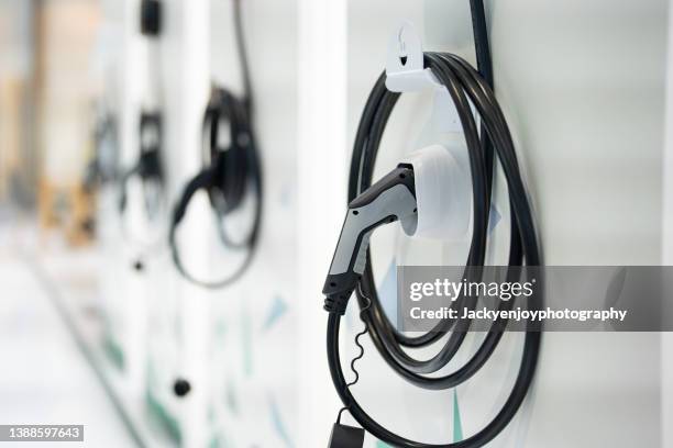 an indoor electric charging station - charge stockfoto's en -beelden