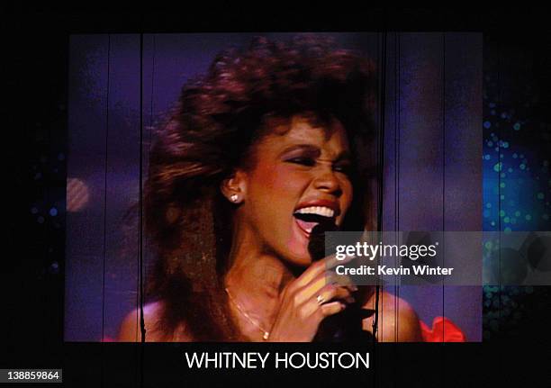 Whitney Houston is displayed on the screen during Jennifer Hudson's performance onstage at the 54th Annual GRAMMY Awards held at Staples Center on...