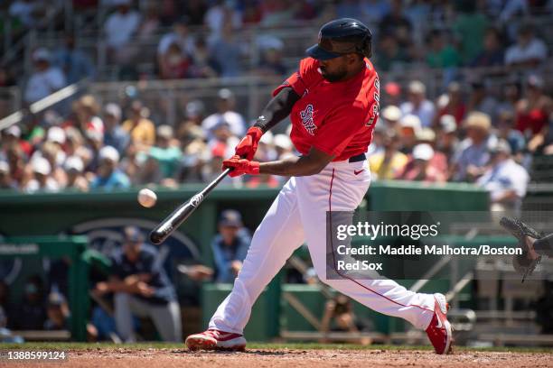 Jackie Bradley Jr. #19 of the Boston Red Sox hits a home run during a Grapefruit League game against the Tampa Bay Rays at JetBlue Park at Fenway...