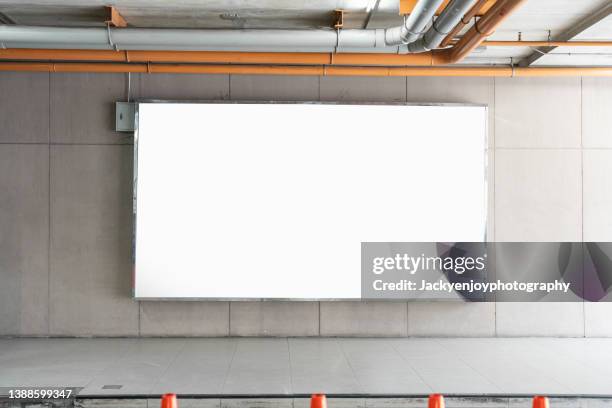 blank standy advertising billboard in the modern building - man standing white background stock-fotos und bilder