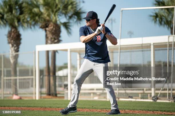 Major League Field Coordinator Andy Fox of the Boston Red Sox hits ground balls during spring training team workouts at JetBlue Park at Fenway South...