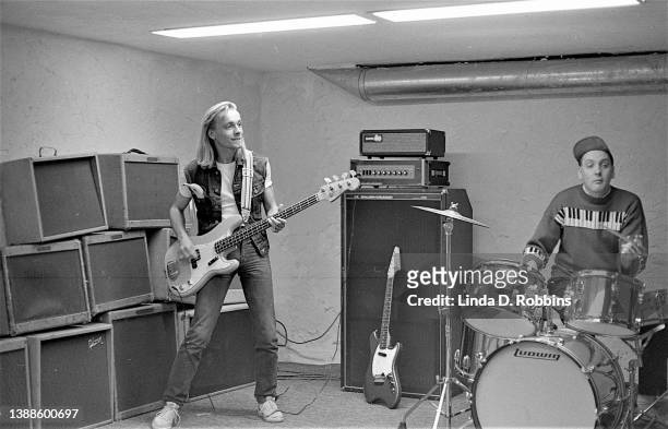 An informal Cheap Trick jam session in Rick Nielsen's Rockford basement. Singer Robin Zander plays bass while guitarist Nielsen is on drums,1980.
