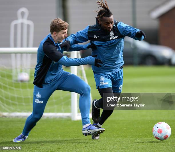 Matt Targett and Allan Saint-Maximin jostles for the ball during the Newcastle United Training session at the Newcastle United Training Centre on...